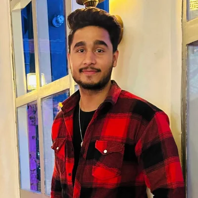 Yash Panwar – Data Specialist wearing white shirt, smiling confidently